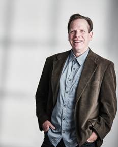 A person in a brown jacket  AI-generated content may be incorrect.